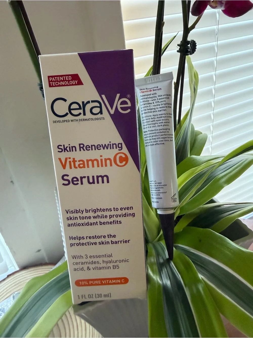 rave Vitamin C Serum Tube and Box in White and Purple